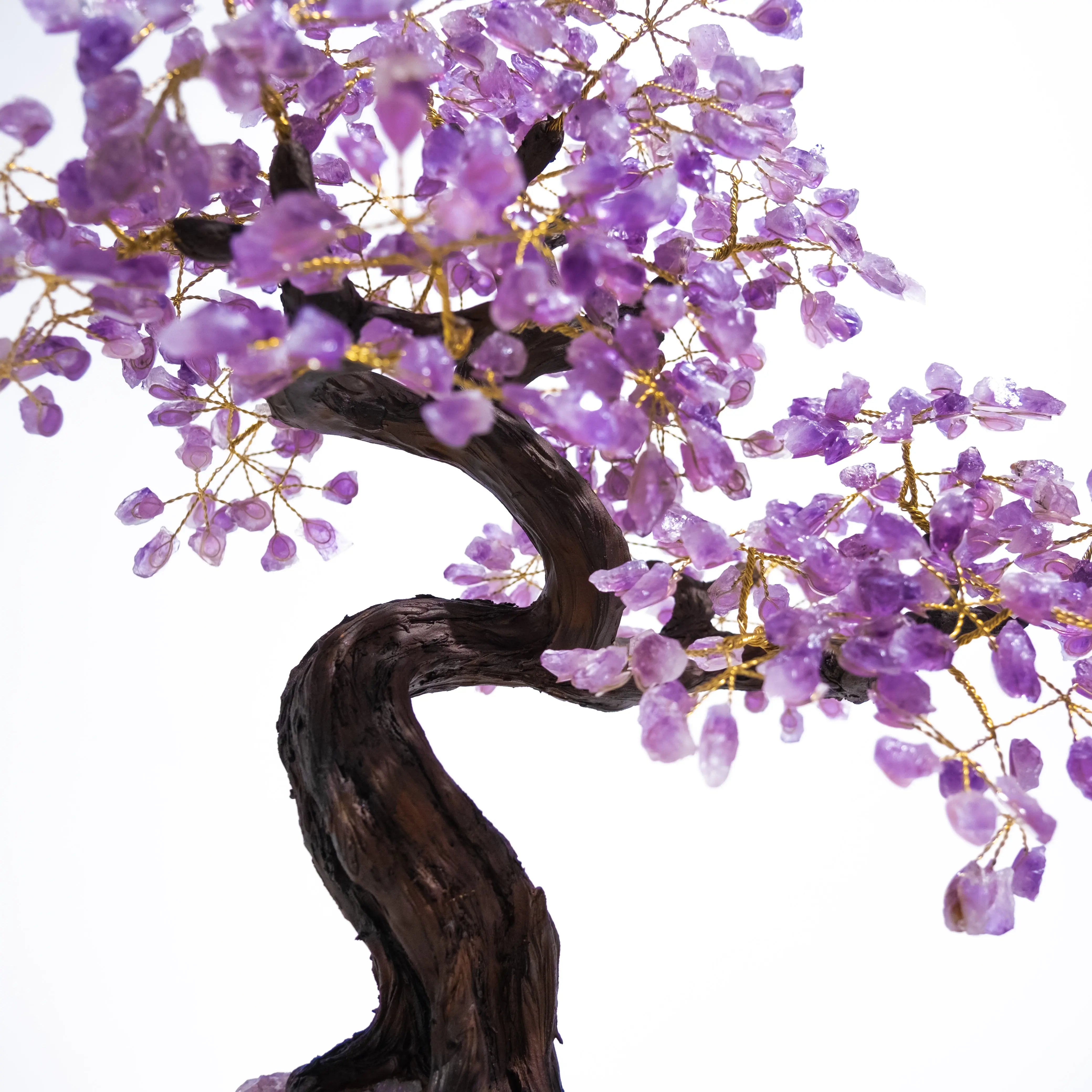 Amethyst crystal bonsai tree with purple gemstone leaves, promoting calming energy and spiritual harmony, 55 cm tall.