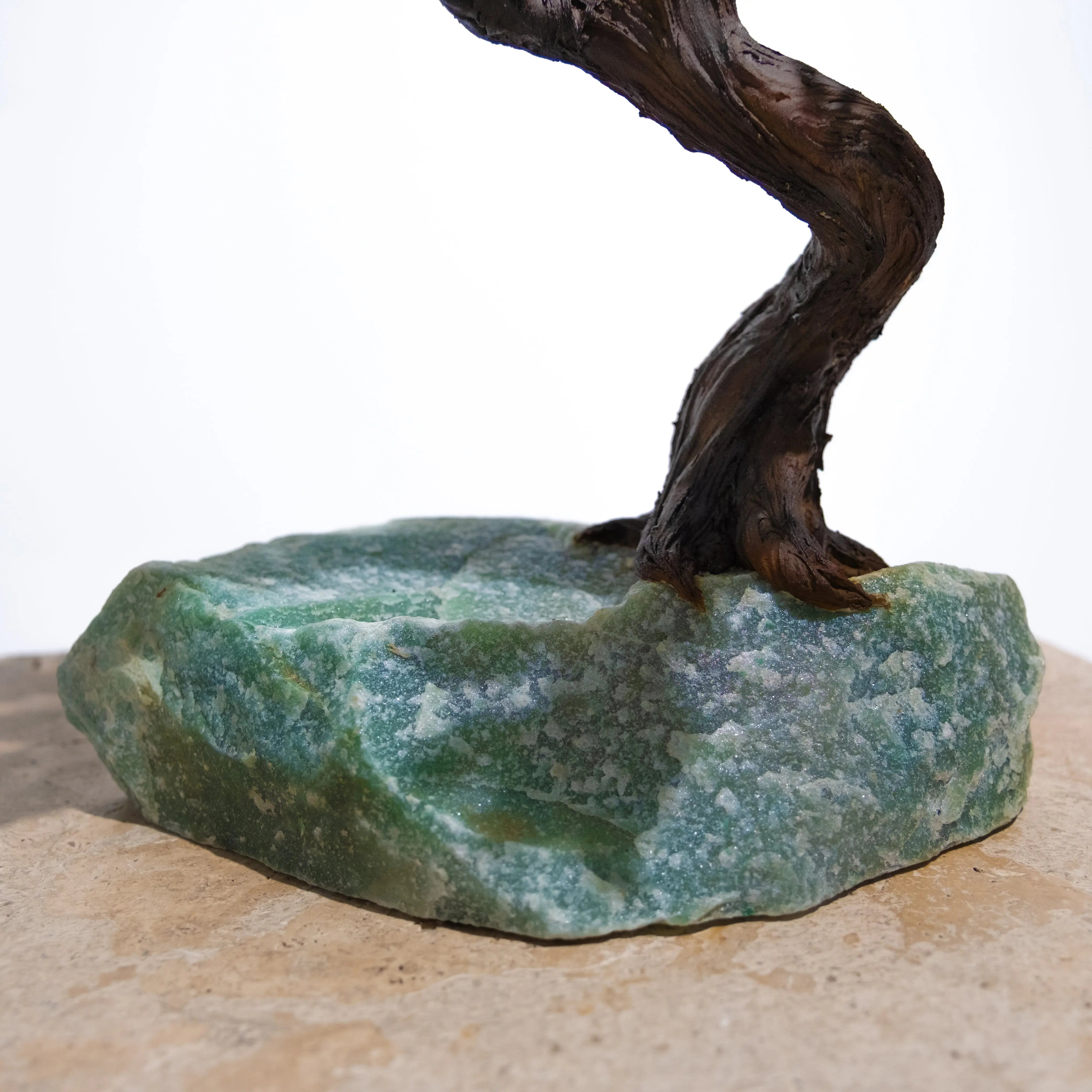 Close-up of Rough Aventurine Crystal Bonsai Tree base, symbolizing prosperity and positive energy in home decor.