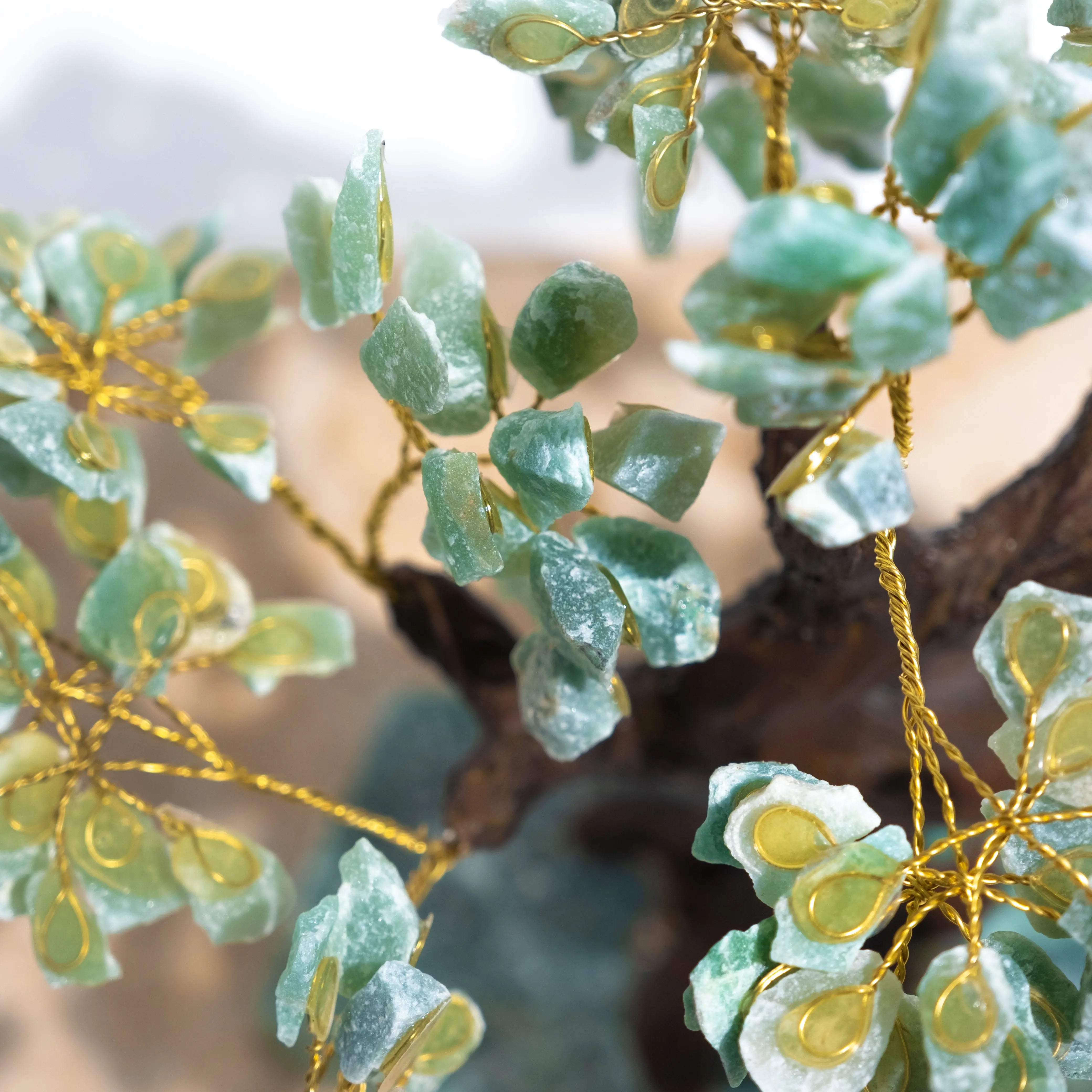 Close-up of Rough Aventurine Crystal Bonsai Tree with green aventurine leaves symbolizing prosperity and harmony.