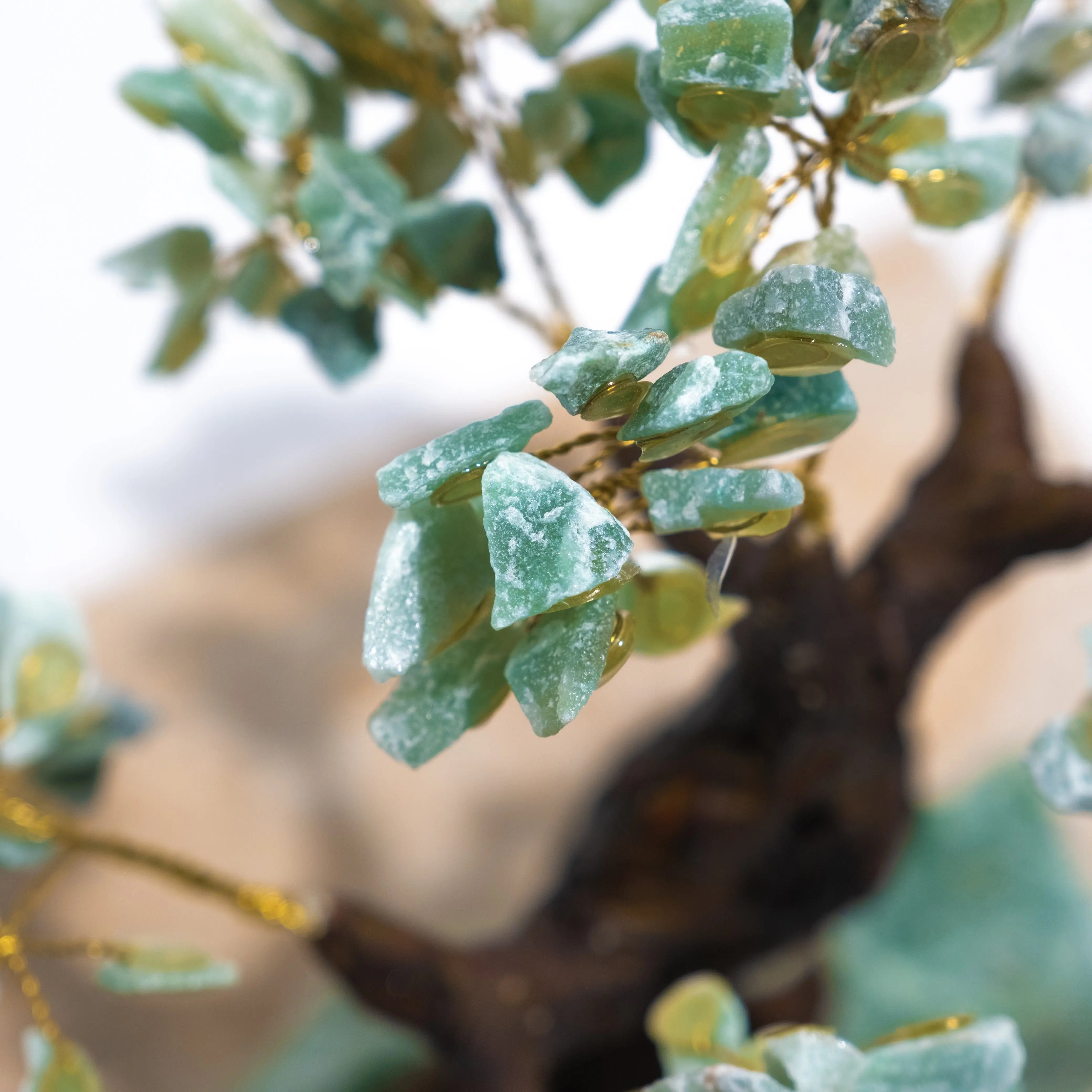 Close-up of handcrafted Rough Aventurine Crystal Bonsai Tree showcasing green crystals symbolizing prosperity and positive energy.