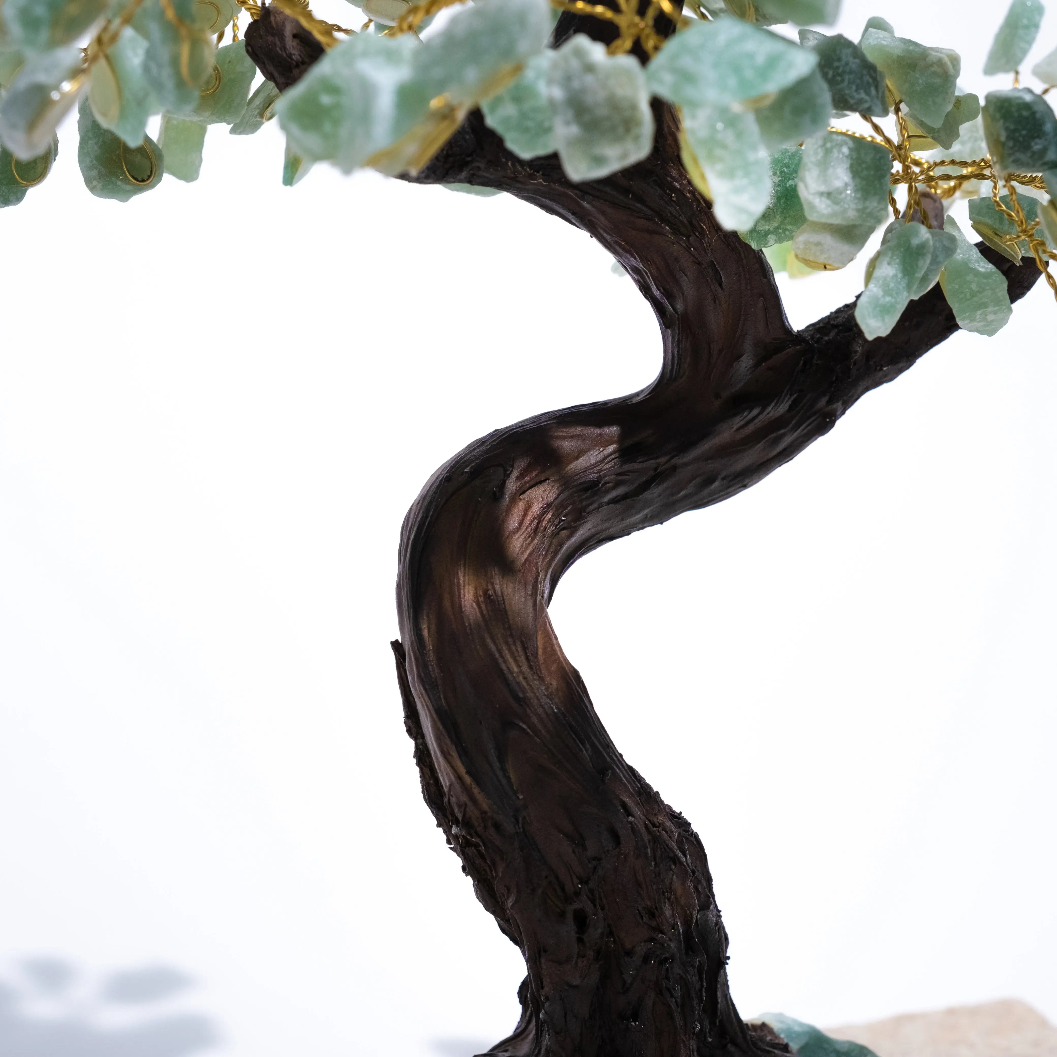 Close-up of a handcrafted Rough Aventurine Crystal Bonsai Tree trunk and leaves, symbolizing prosperity and harmony.