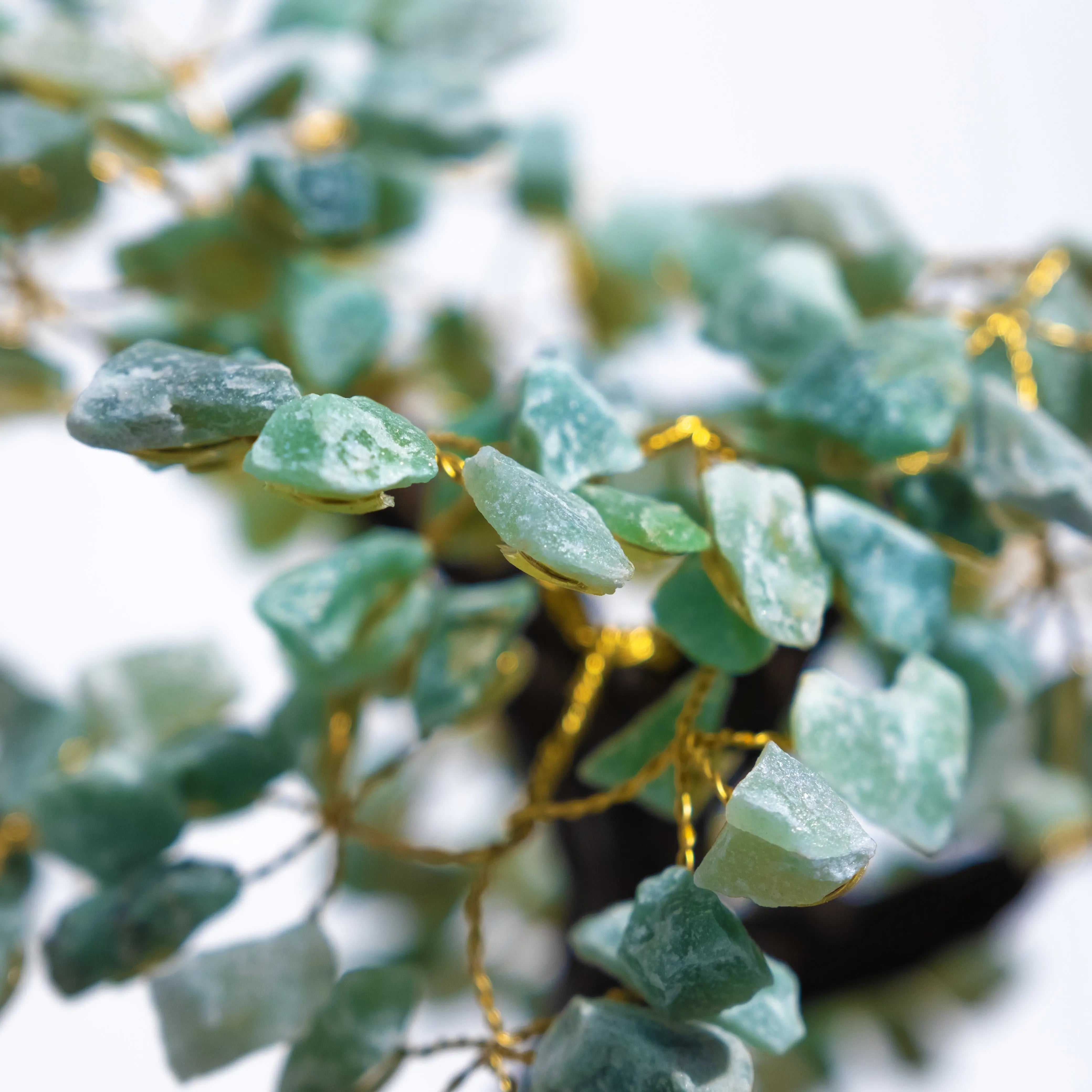 Close-up view of Rough Aventurine Crystal Bonsai Tree, showcasing green crystals for prosperity and positive energy.