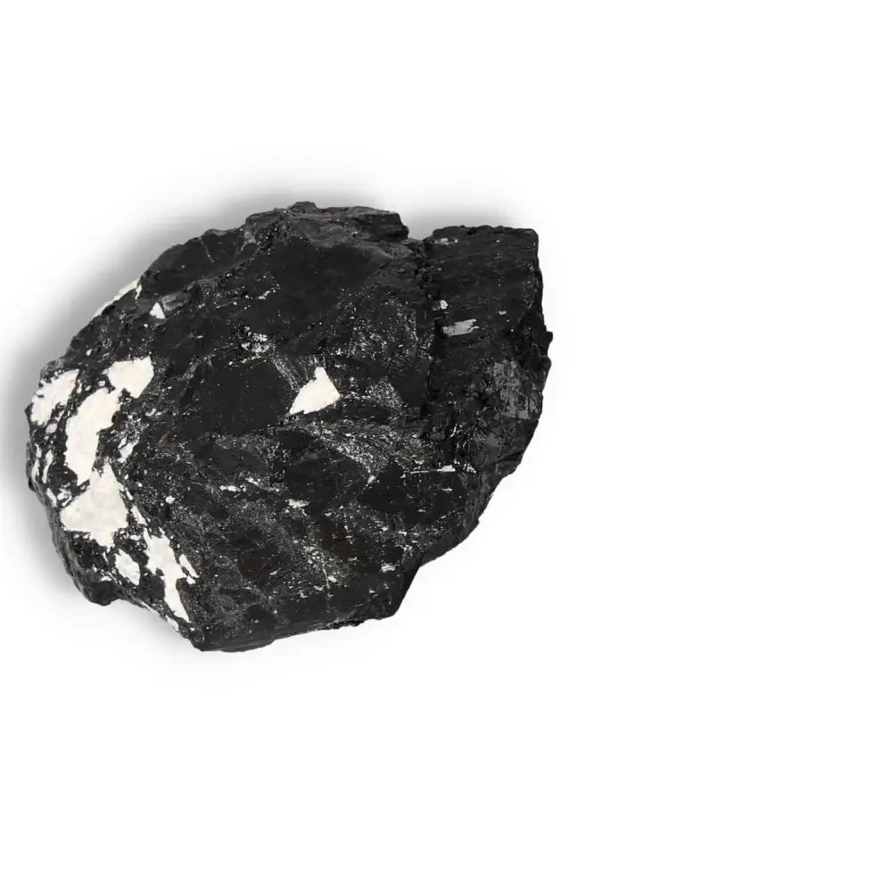 Rough Black Tourmaline Druze L from Sylvia Crystals, known for transformative energy and luxury, cleanses negative energies.