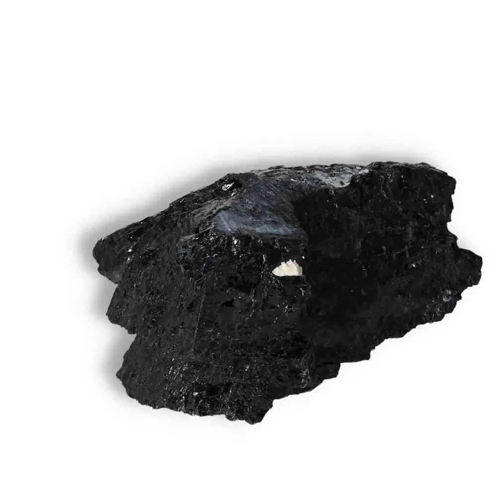 Rough Black Tourmaline Druze L crystal by Sylvia Crystals on white background, known for purification and powerful energy properties.