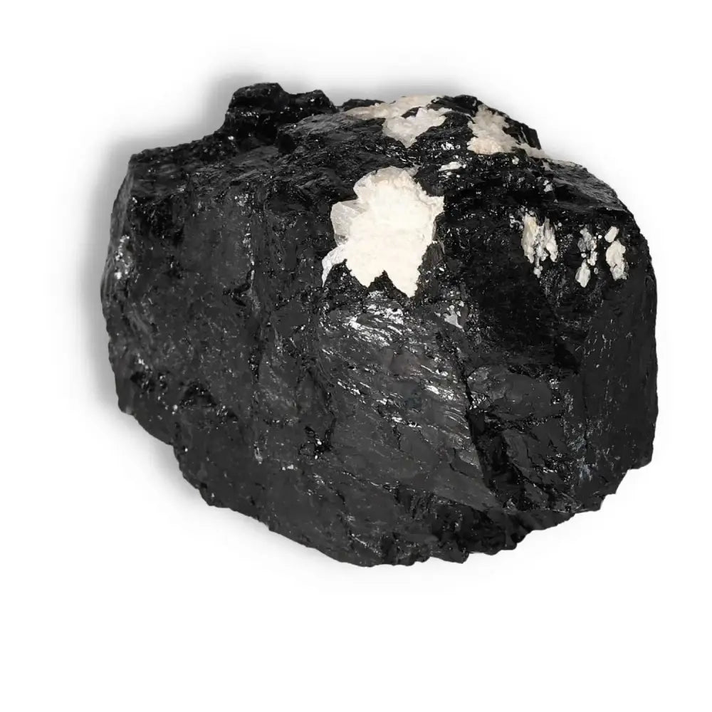 Rough Black Tourmaline Druze crystal piece from Sylvia Crystals, used for cleansing negative energies and grounding, with white druzy accents.