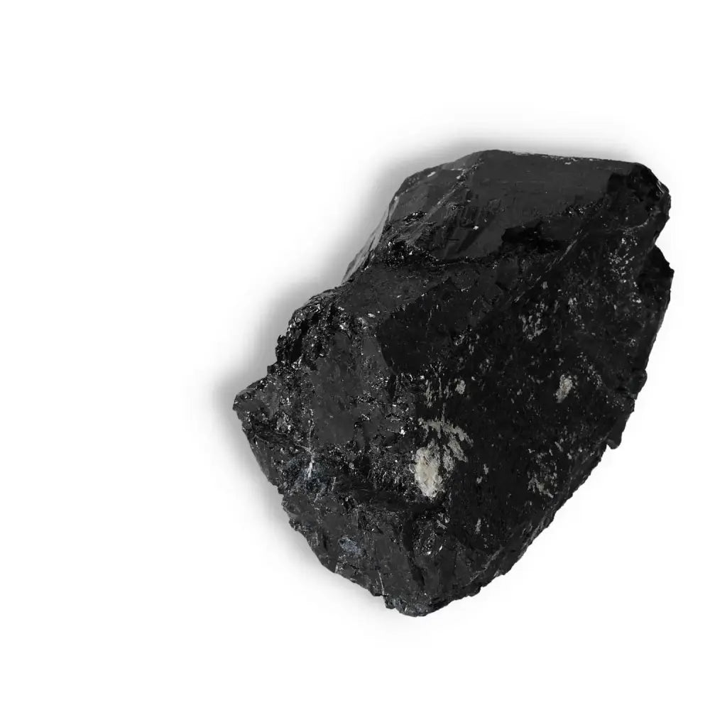 Rough Black Tourmaline Druze crystal, known for protection and energy cleansing, from Sylvia Crystals, on a white background.