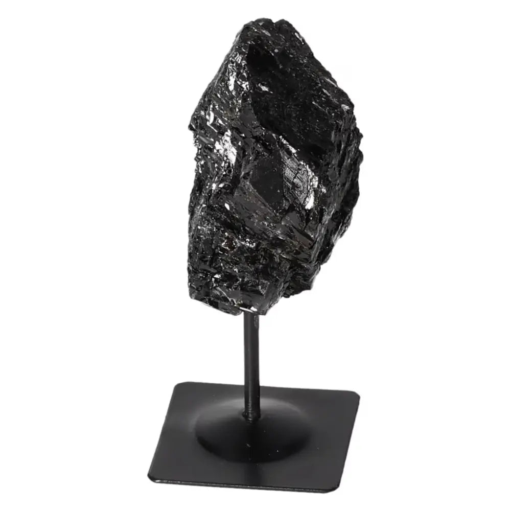 Rough Black Tourmaline on Metal Stand, Sylvia Crystals. Luxurious, spiritual decor with cleansing energy, perfect for positive ambiance.