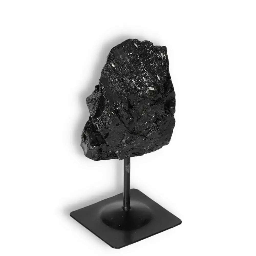Rough Black Tourmaline with Metal Stand M from Sylvia Crystals, known for luxury and spiritual grounding properties.