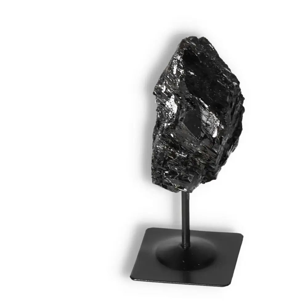 Rough Black Tourmaline with Metal Stand M by Sylvia Crystals, showcasing luxury and spiritual grounding properties.