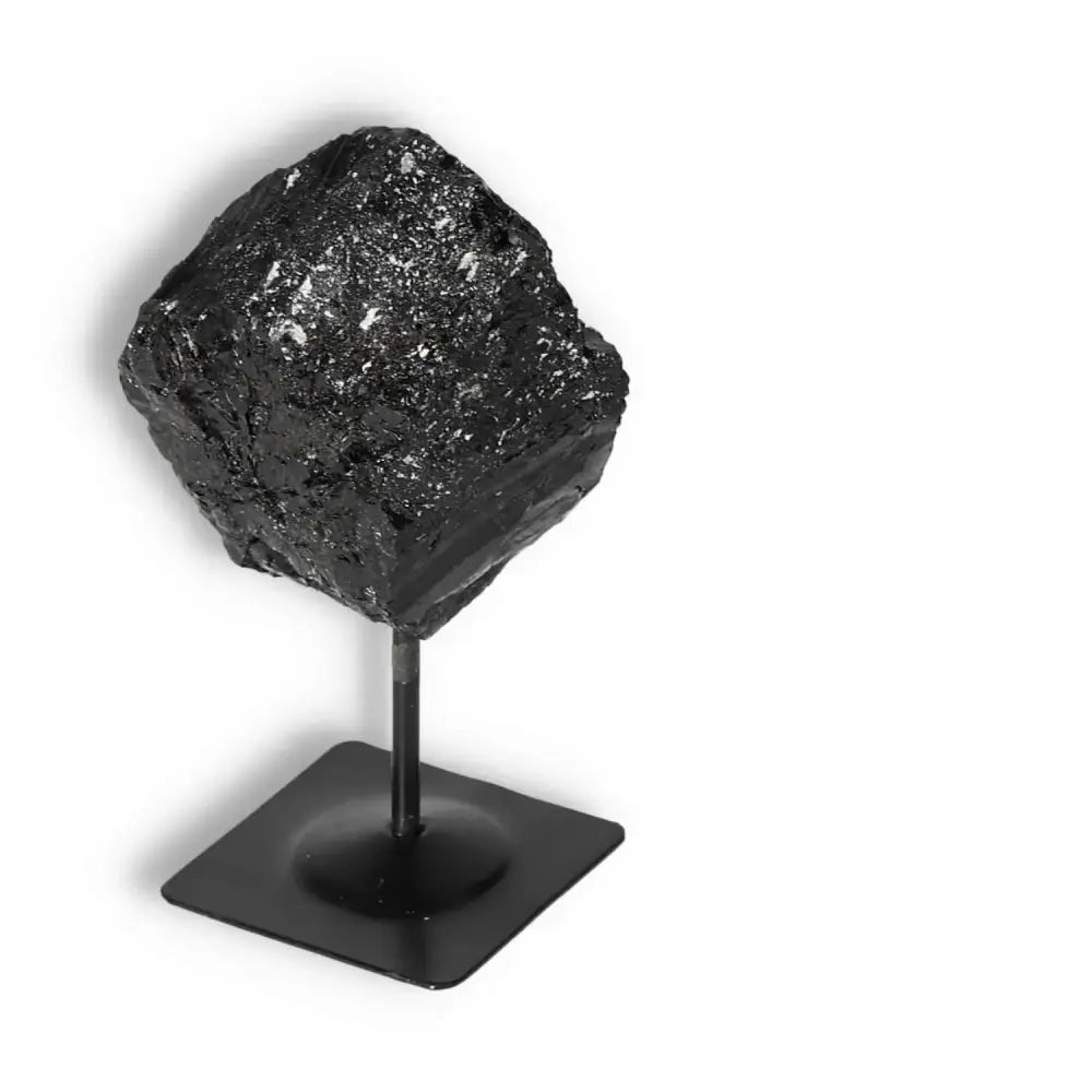 Rough Black Tourmaline with Metal Stand M from Sylvia Crystals, showcasing luxury and spiritual grounding properties.