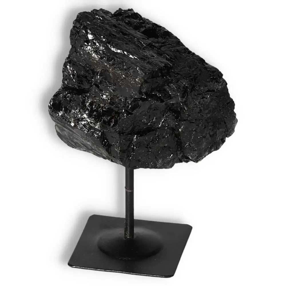 Rough Black Tourmaline on Metal Stand by Sylvia Crystals, renowned for energy purification and negativity neutralization.