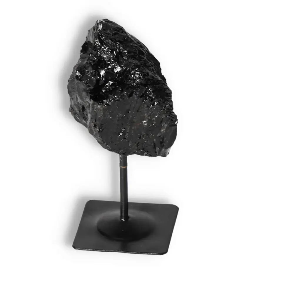 Rough Black Tourmaline with Metal Stand S from Sylvia Crystals, designed to cleanse and transform negative energies.