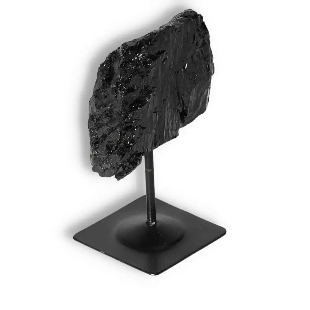 Rough Black Tourmaline with Metal Stand S by Sylvia Crystals, known for cleansing negative energies and promoting emotional healing.
