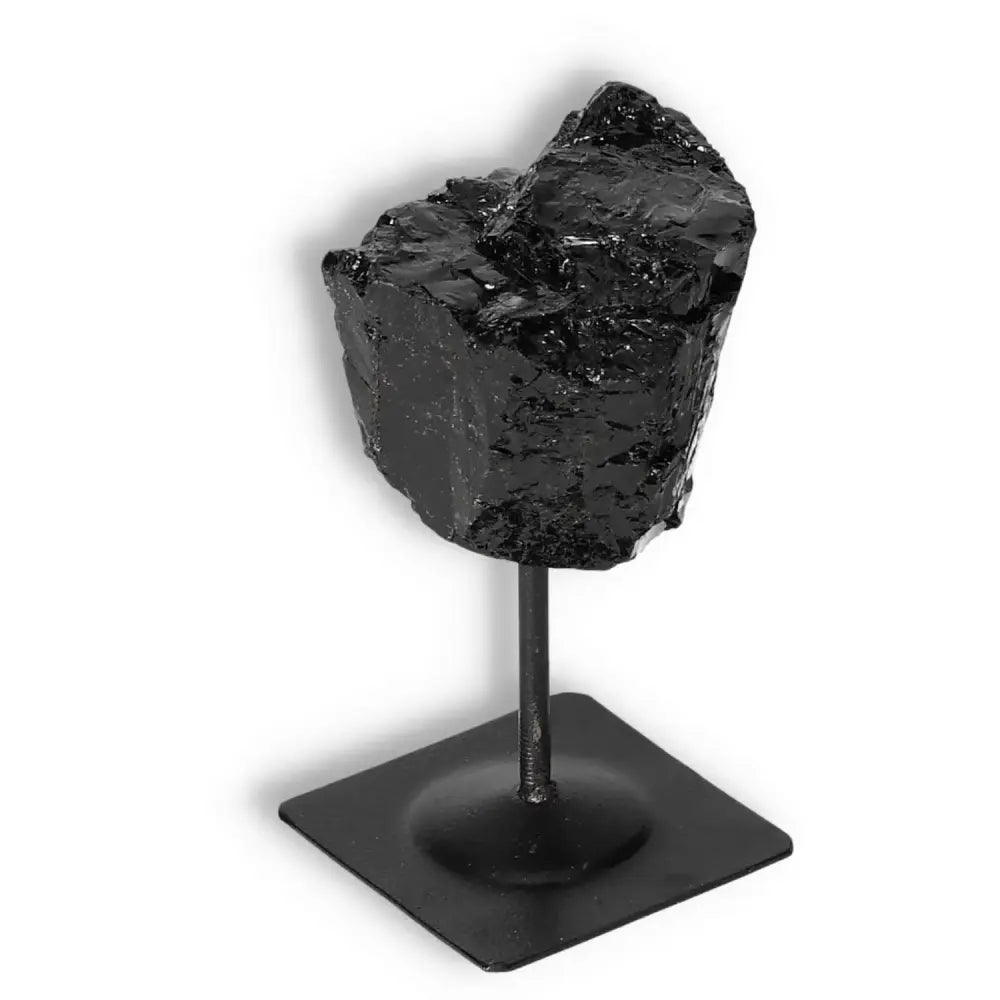 Rough Black Tourmaline with Metal Stand S for energy cleansing from Sylvia Crystals, premium natural stone display.