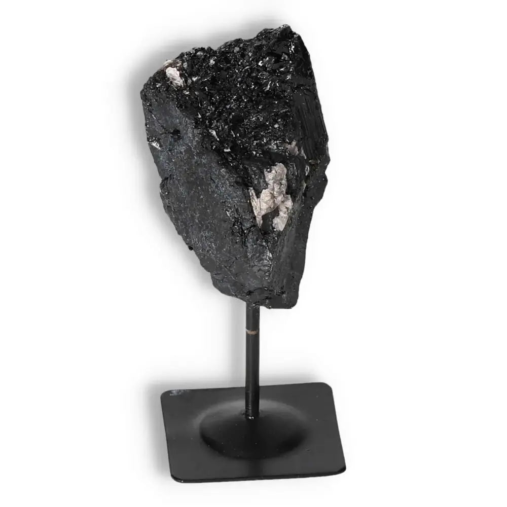 Rough Black Tourmaline with Metal Stand, luxurious crystal by Sylvia Crystals, known for its cleansing properties and spiritual balance.