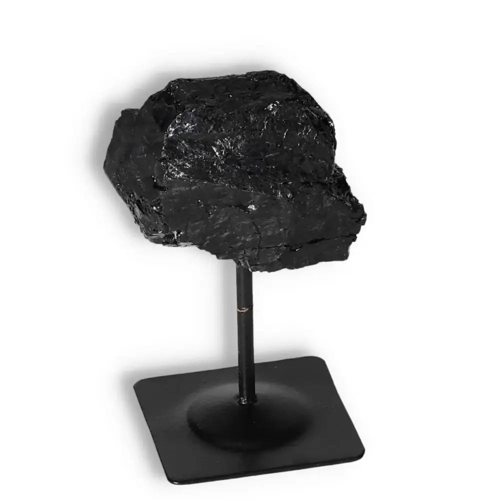 Rough Black Tourmaline on Metal Stand S from Sylvia Crystals, ideal for cleansing and transforming negative energies.
