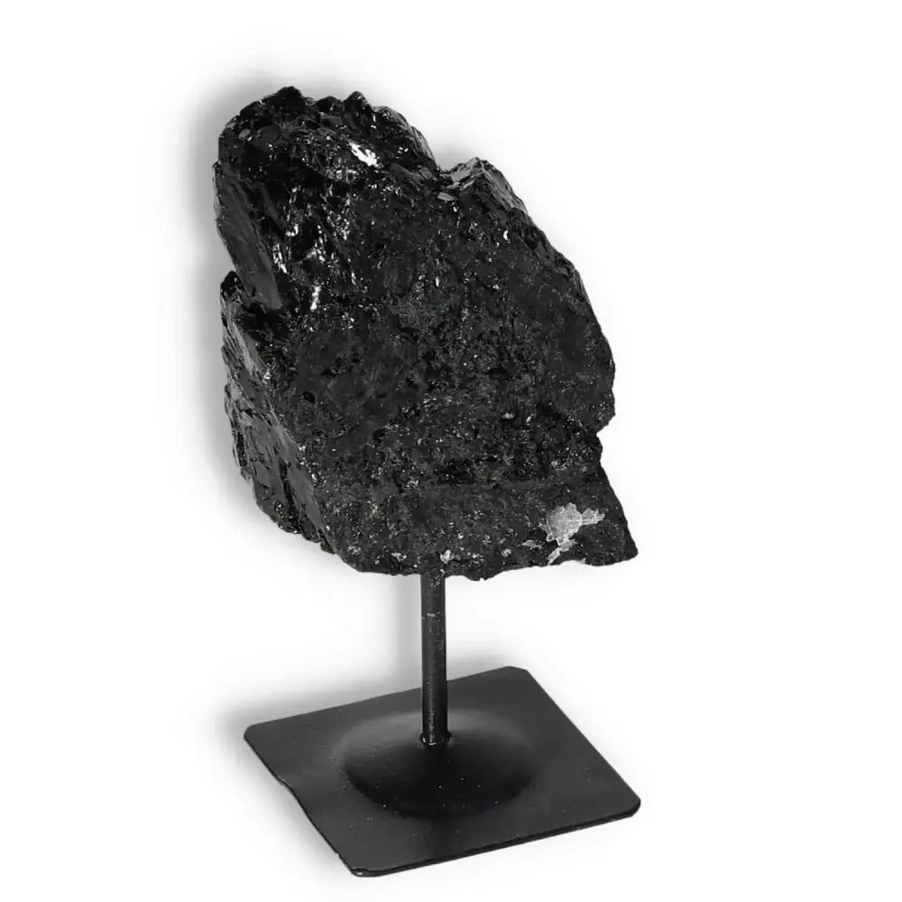 Rough Black Tourmaline with metal stand, premium crystal from Sylvia Crystals, known for cleansing and transforming negative energies.