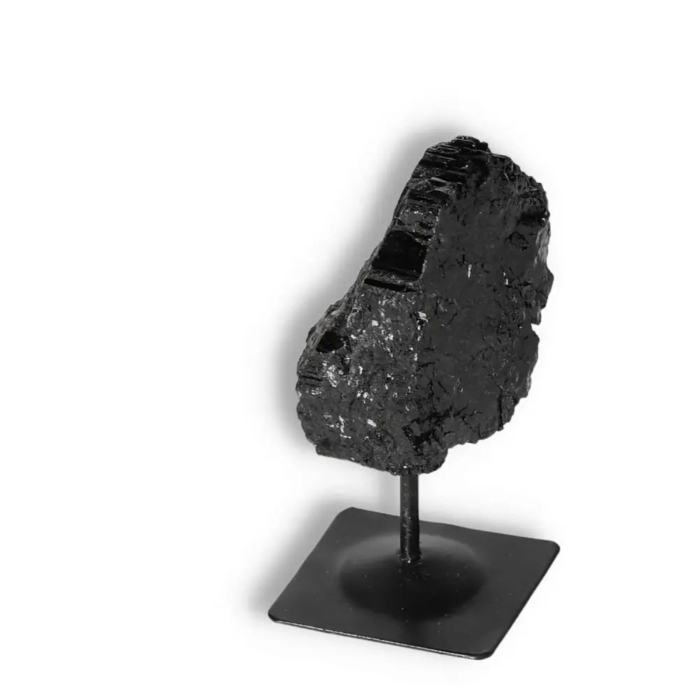 Rough Black Tourmaline with Metal Stand S by Sylvia Crystals, a tool for energy transformation and decor. Handpicked for quality.