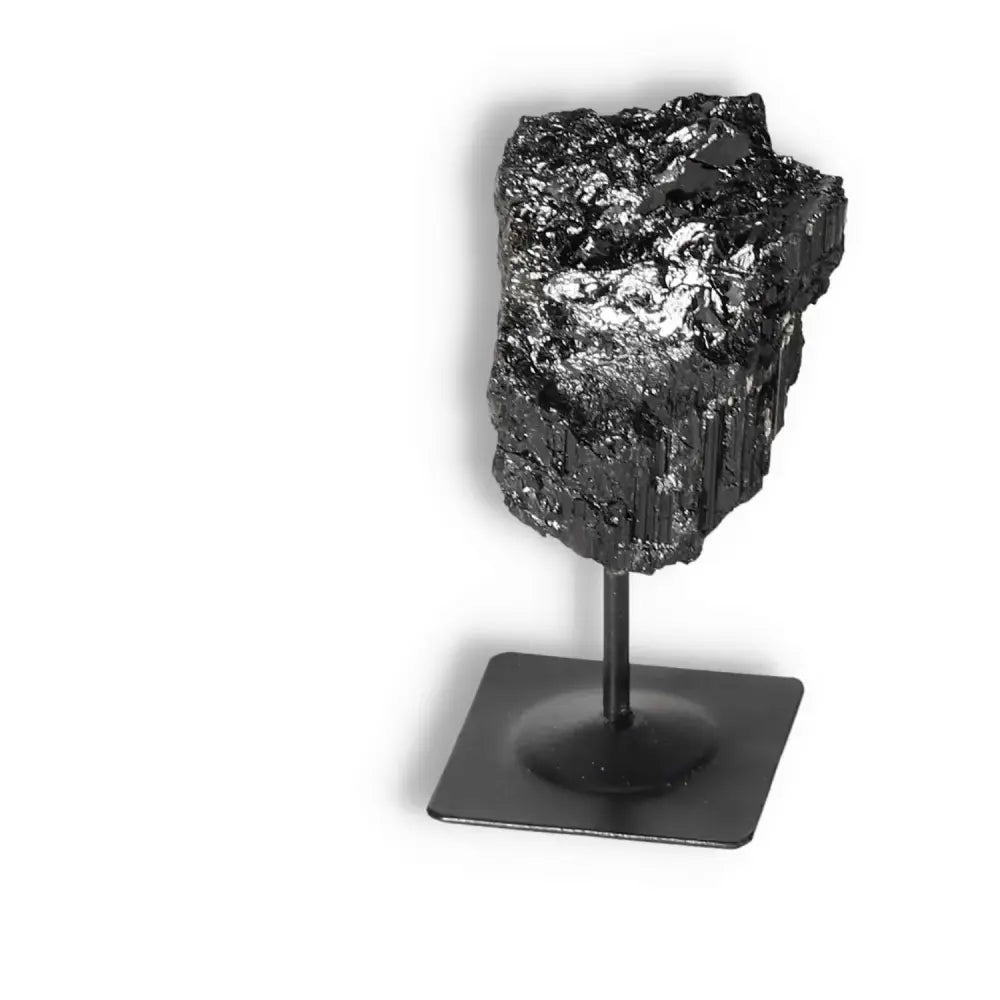 Rough Black Tourmaline on metal stand, premium Sylvia Crystals selection, cleanses negative energies, high quality