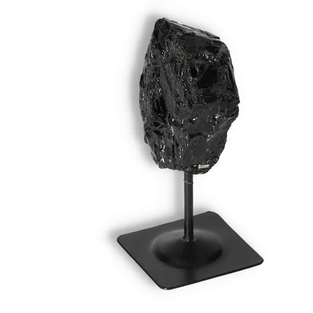 Rough Black Tourmaline gemstone with metal stand, luxury spiritual enhancer from Sylvia Crystals