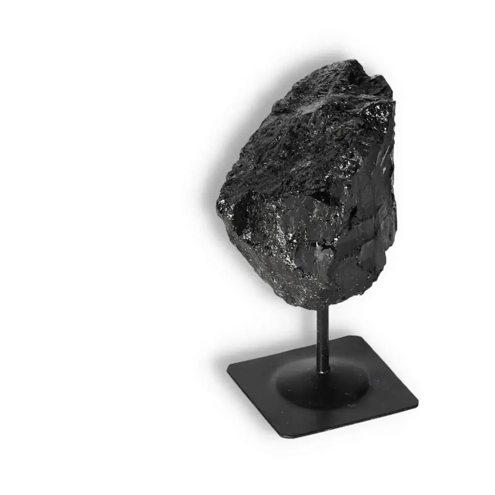 Rough Black Tourmaline on Metal Stand for cleansing and grounding by Sylvia Crystals, premium quality, handpicked for authenticity.