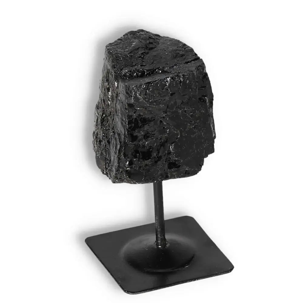 Rough Black Tourmaline with metal stand, premium quality crystal from Sylvia Crystals, known for cleansing negative energies.