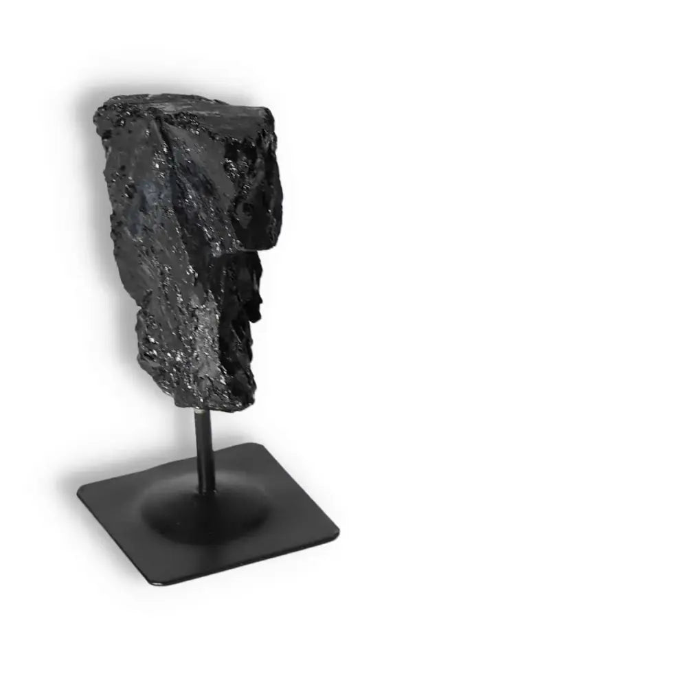 Rough Black Tourmaline on Metal Stand, perfect for grounding and energy healing, offered by Sylvia Crystals.