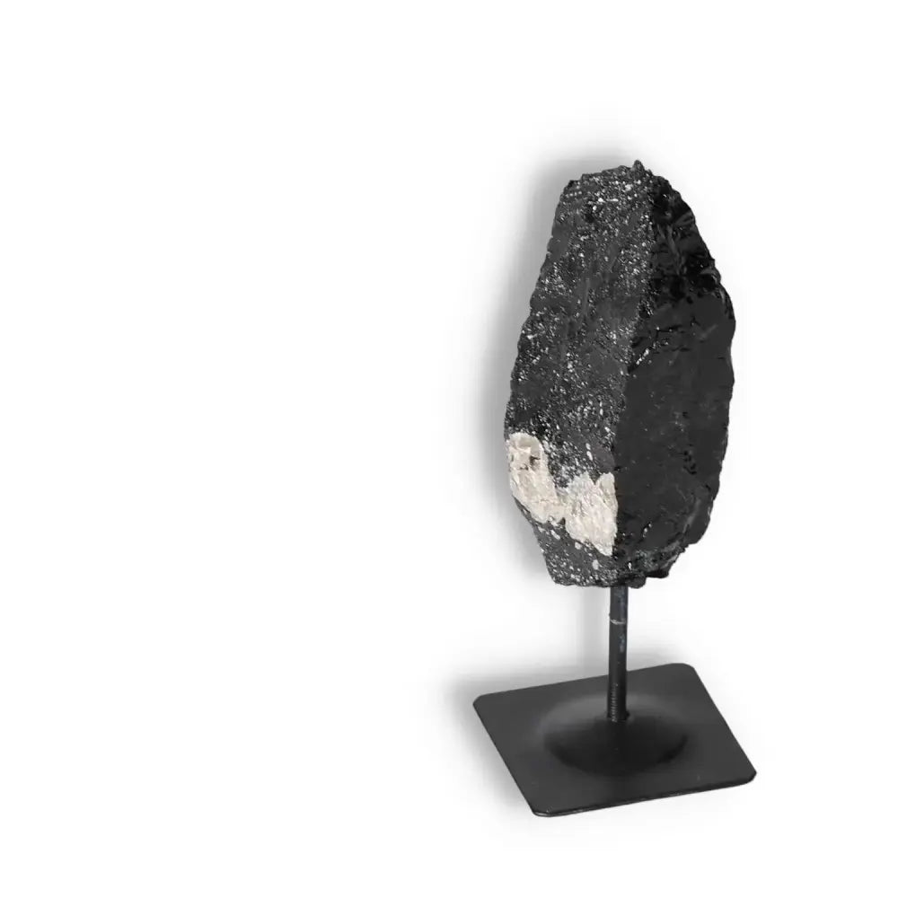 Rough Black Tourmaline with Metal Stand S by Sylvia Crystals, offering protection and elegance, perfect for home decor.