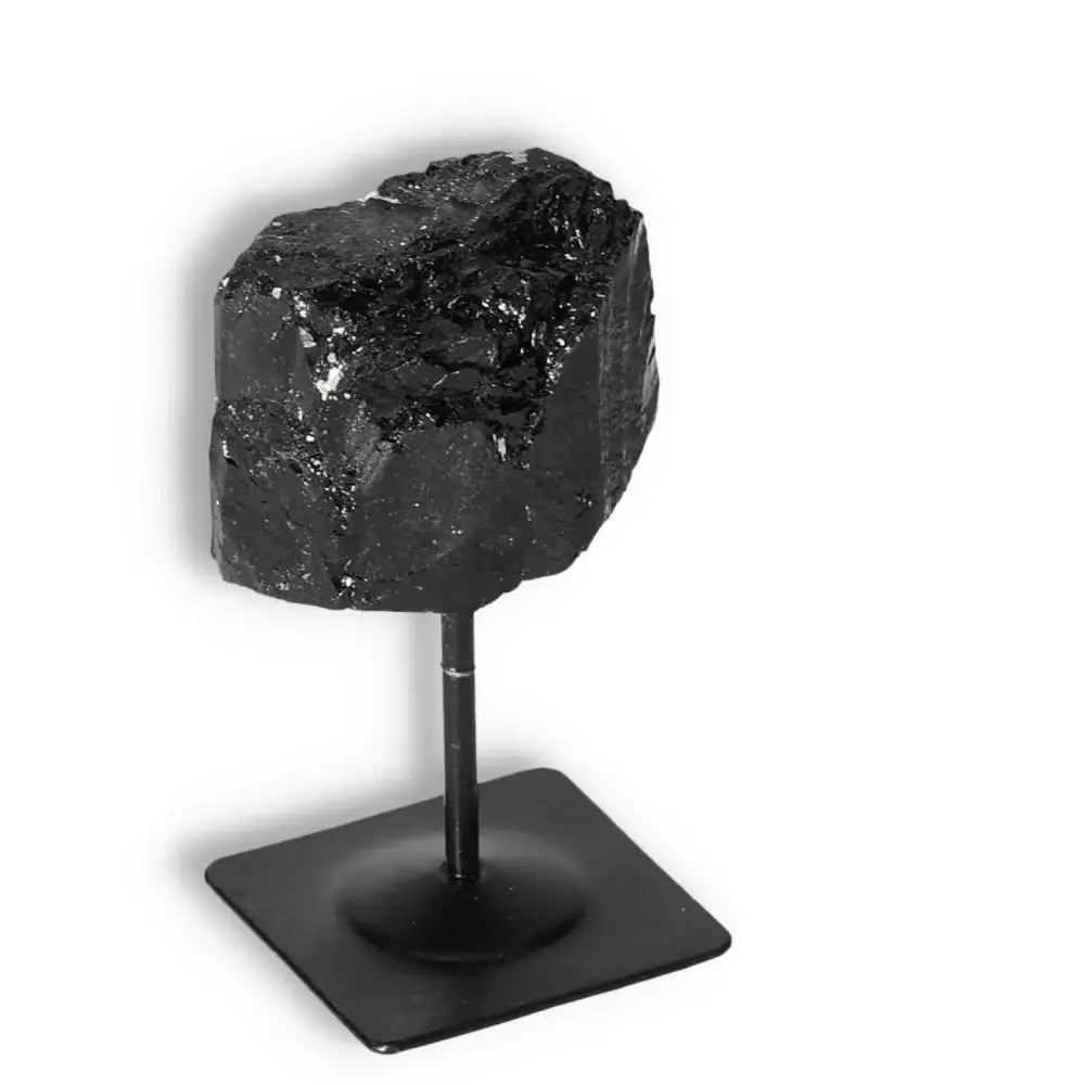 Elegant Rough Black Tourmaline on Metal Stand from Sylvia Crystals, enhancing spiritual harmony and cleansing negative energies.
