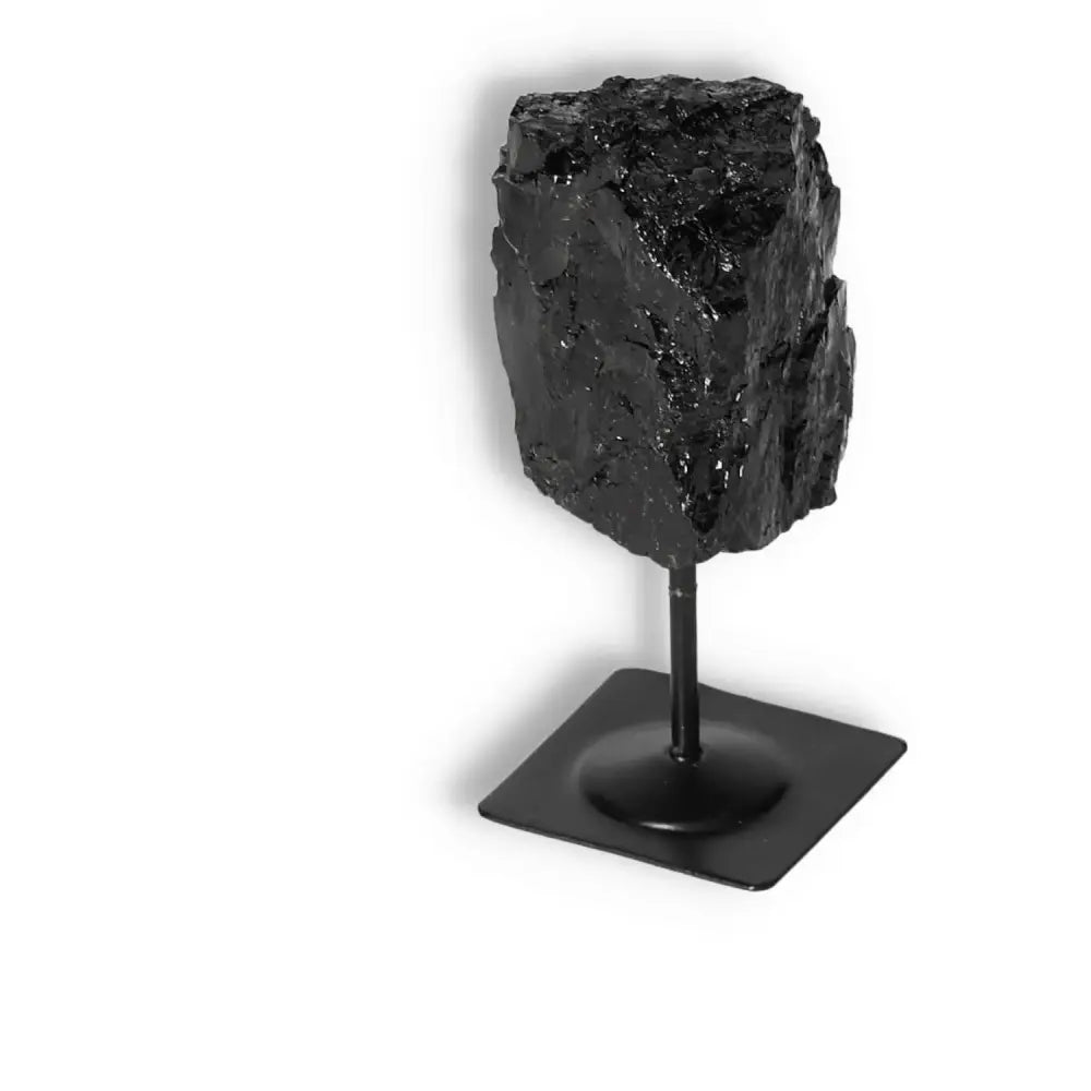 Rough Black Tourmaline on Metal Stand S by Sylvia Crystals, promotes energy cleansing, grounding, and root chakra support.