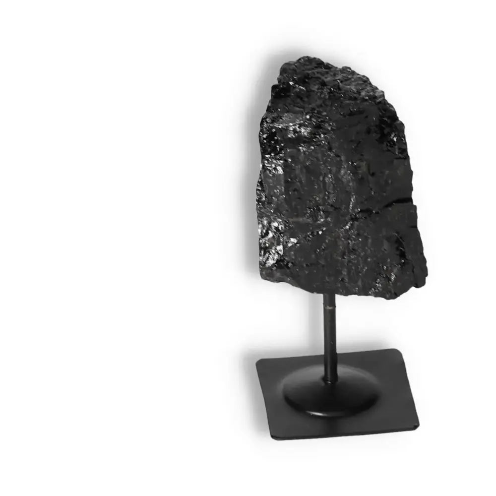 Rough Black Tourmaline on Metal Stand, perfect for energy cleansing and grounding, from Sylvia Crystals.