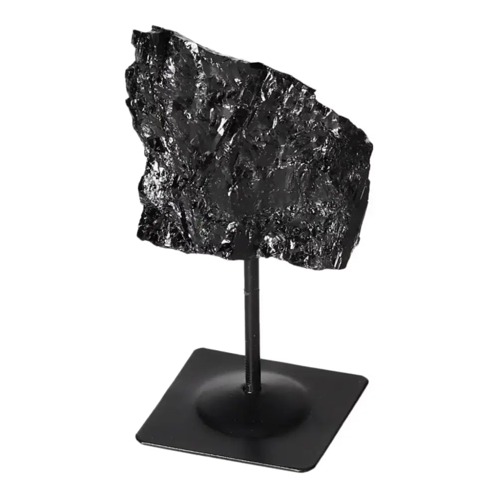 Rough Black Tourmaline on Metal Stand S, promoting cleansing and transformation, available at Sylvia Crystals.