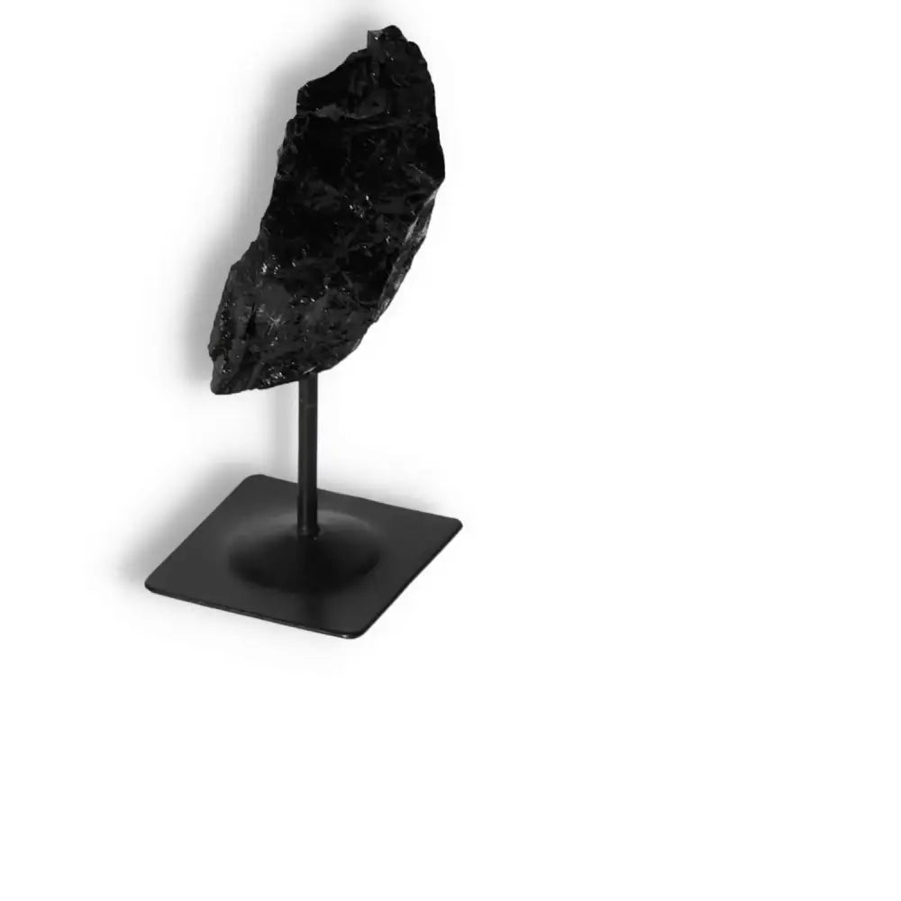 Rough Black Tourmaline with Metal Stand S by Sylvia Crystals, known for cleansing and enhancing concentration.