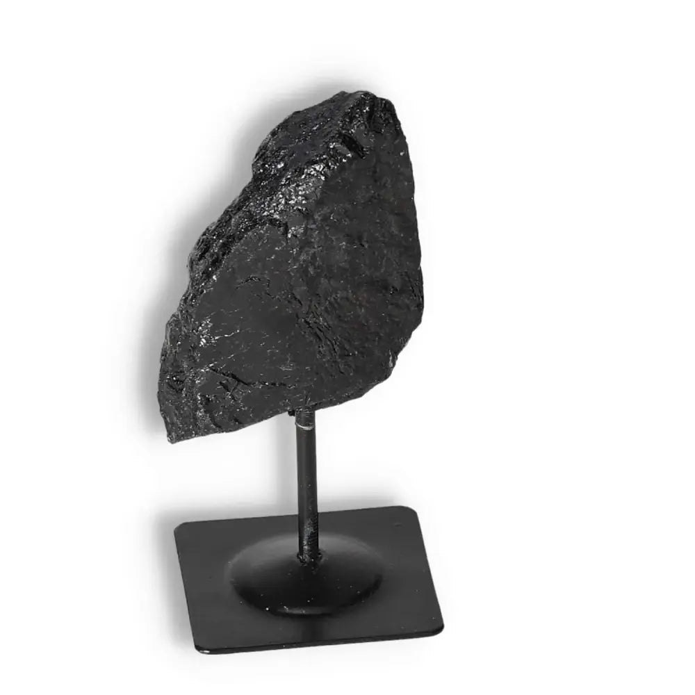 Rough Black Tourmaline on Metal Stand S, perfect for cleansing and energy transformation, by Sylvia Crystals. Ideal for home and office decor.