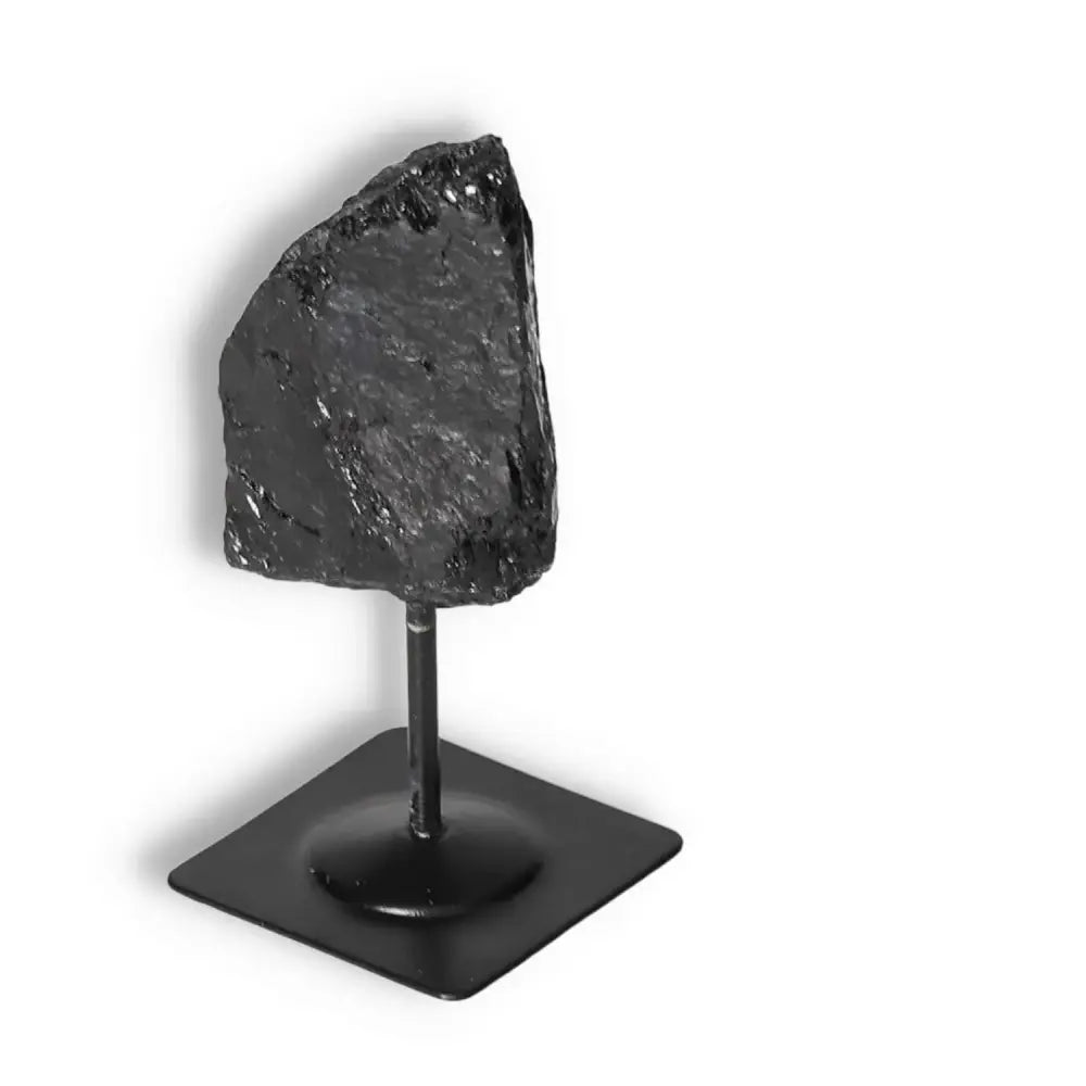 Rough Black Tourmaline with Metal Stand S, crystal from Sylvia Crystals, ideal for cleansing and transformation, on a sleek metal base.
