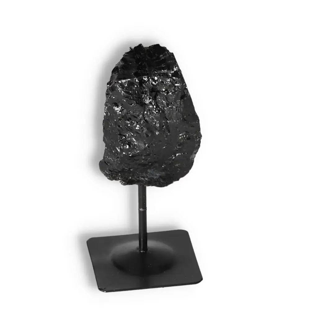 Rough Black Tourmaline on Metal Stand by Sylvia Crystals, known for its energy-clearing and healing properties.