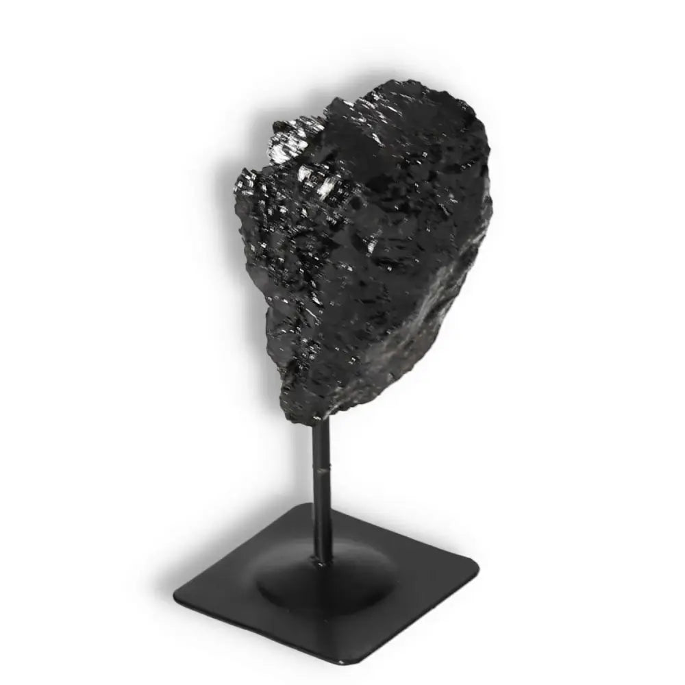 Rough Black Tourmaline on a metal stand from Sylvia Crystals, ideal for home decor and repelling negative energy, premium quality crystal.