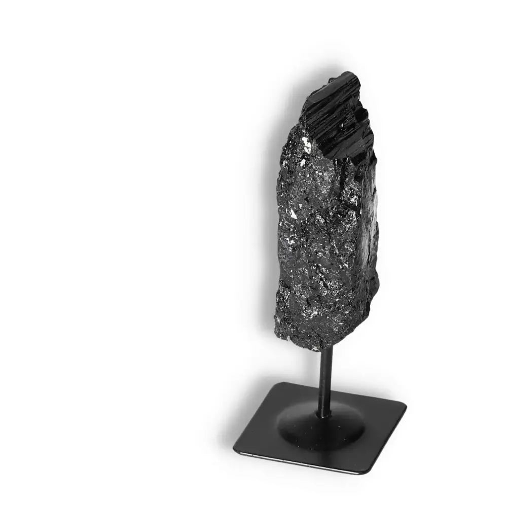 Rough Black Tourmaline on Metal Stand by Sylvia Crystals, perfect for energy cleansing and transformation.