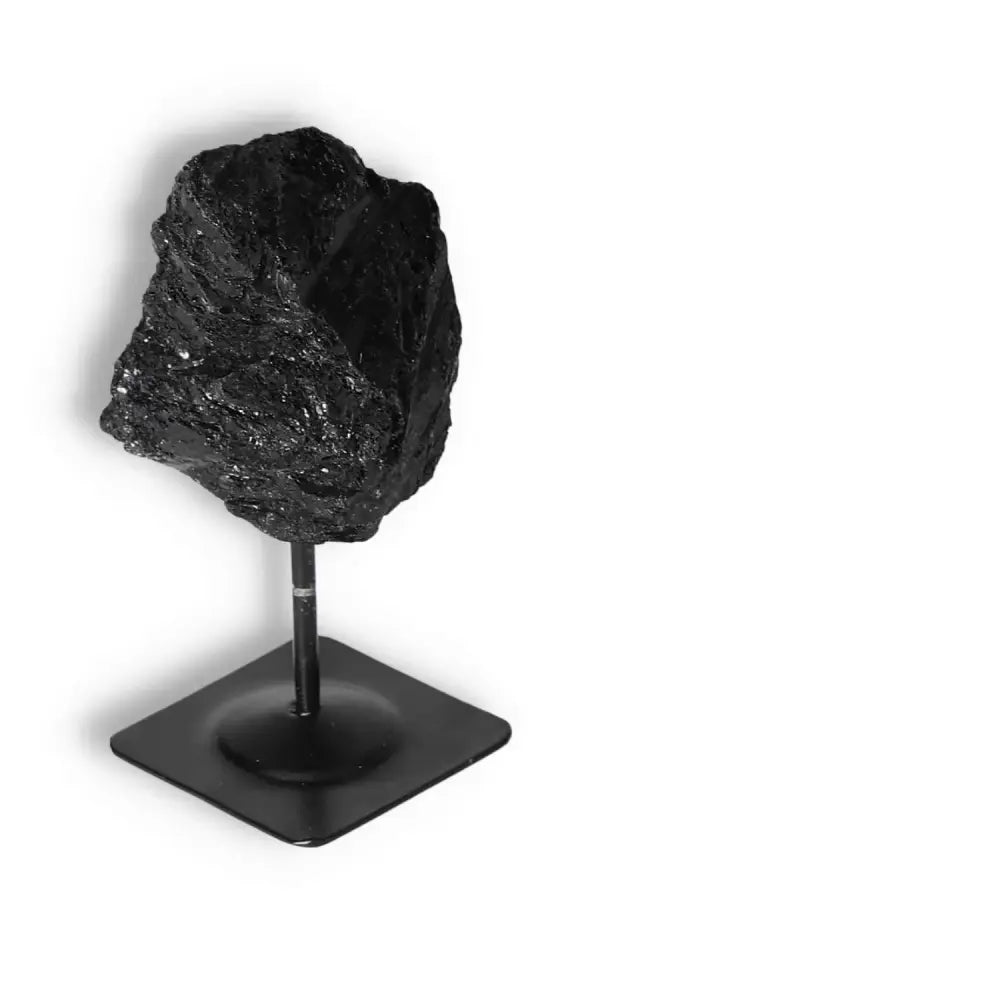 Rough Black Tourmaline with Metal Stand S from Sylvia Crystals, known for cleansing and neutralizing negative energies.