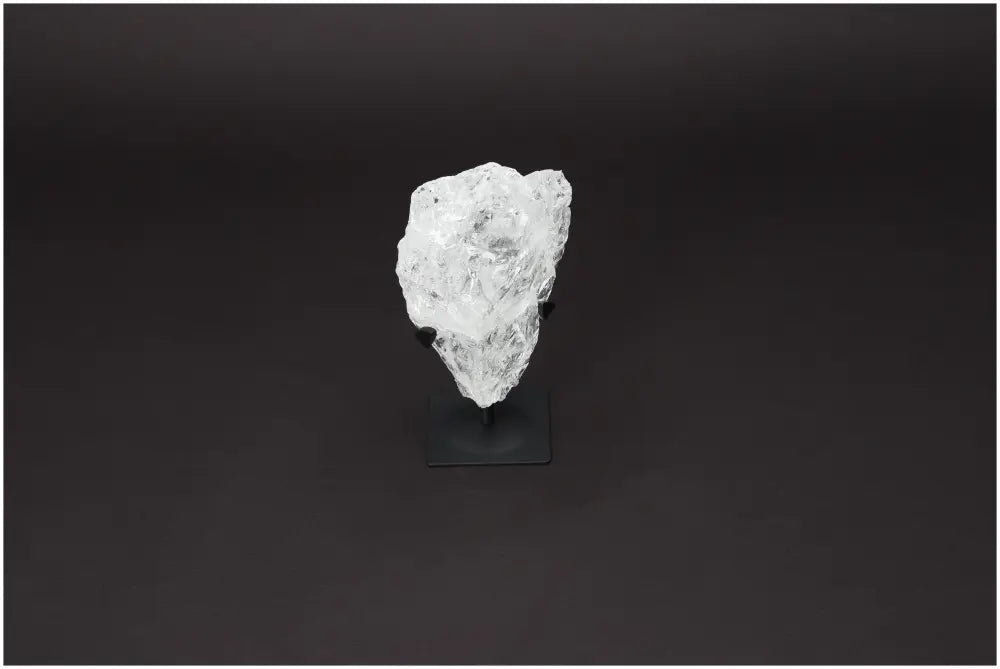 Rough Lemurian Clear Quartz on metal stand, enhances spiritual energy, purifies negative vibes, perfect luxury decor by Sylvia Crystals.