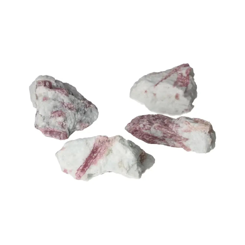 Rough pink tourmaline druze stones symbolizing feminine energy and harmony, ideal for tension release and inner peace.