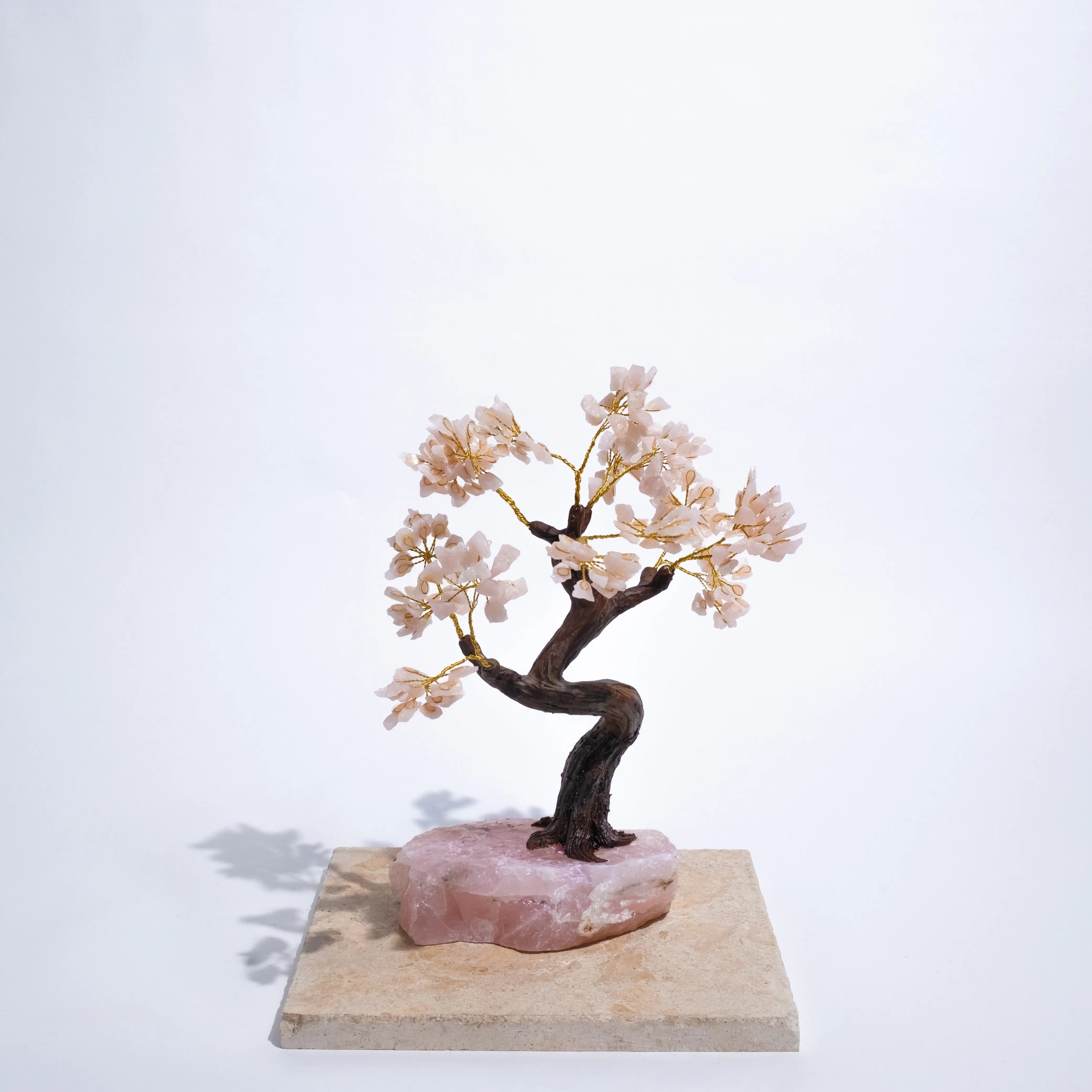 Rough Rose Quartz Tree 45cm with delicate pink crystals, symbolizing love and emotional healing, beautifully displayed on a stone base.