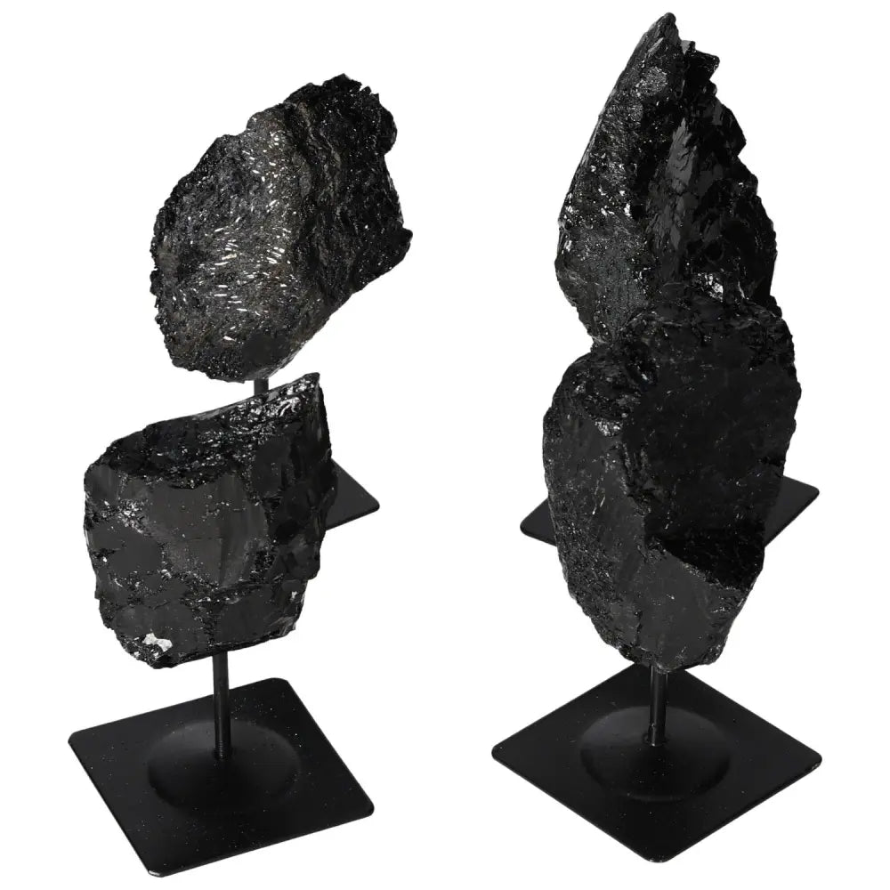 Rough Tourmaline with metal stand showcasing black mineral texture, perfect for modern home decor by Sylvia Crystals.