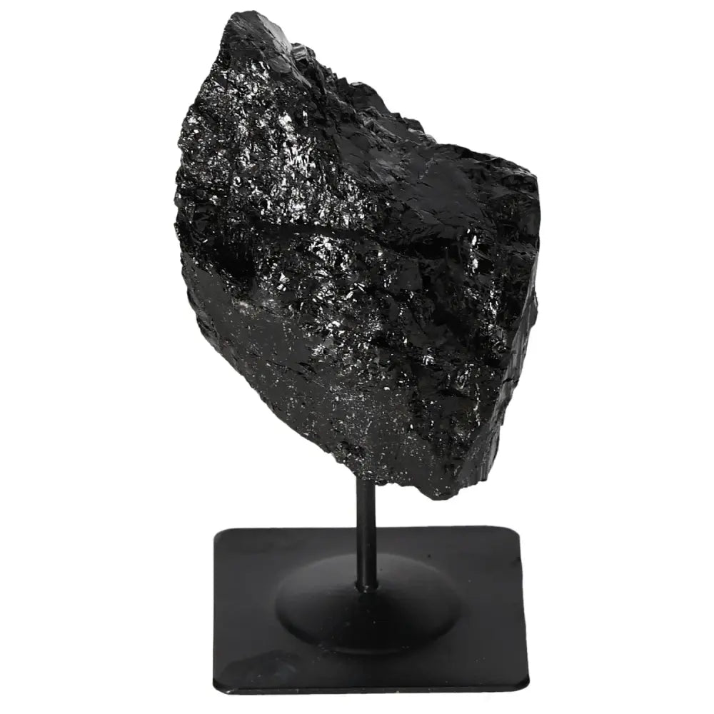 Rough Tourmaline crystal on a metal stand from Sylvia Crystals, showcasing its natural beauty and luxurious design for home or office decor.