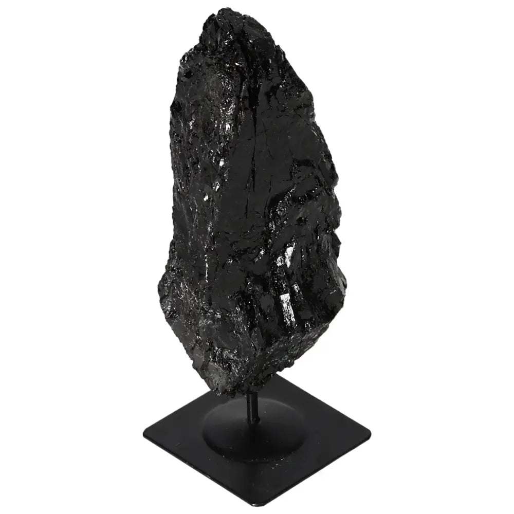 Rough Black Tourmaline on a Metal Stand showcasing natural elegance and energy harmonization, an exquisite Sylvia Crystals piece.