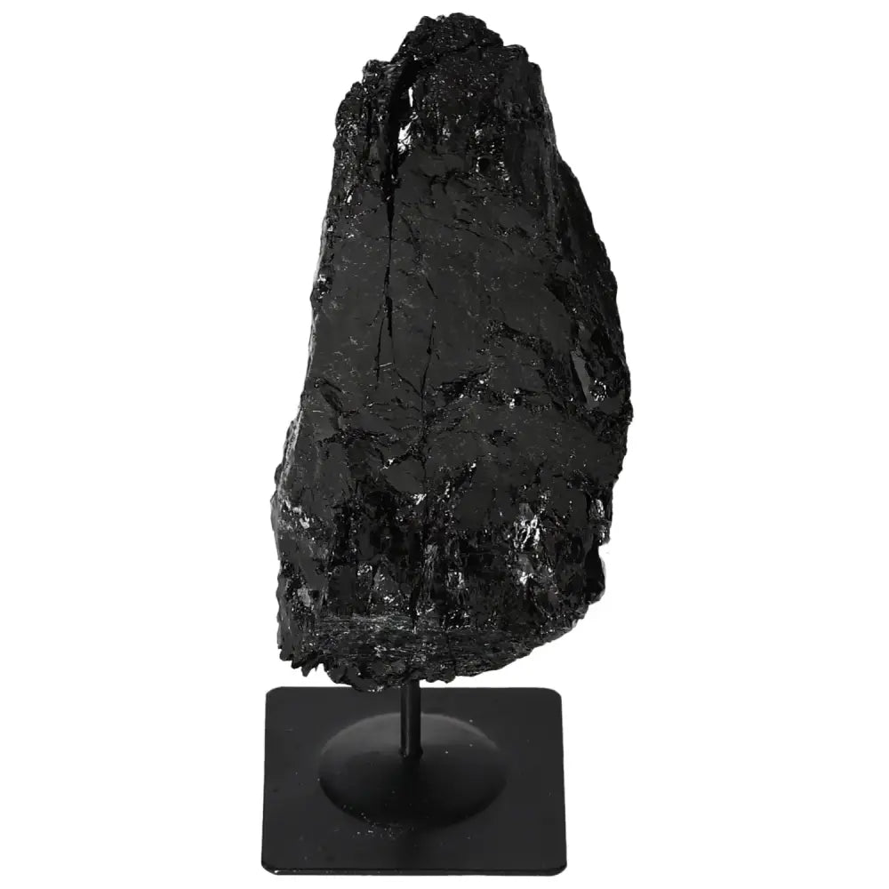 Rough black tourmaline crystal on a metal stand, showcasing natural texture and elegance in a Sylvia Crystals creation.