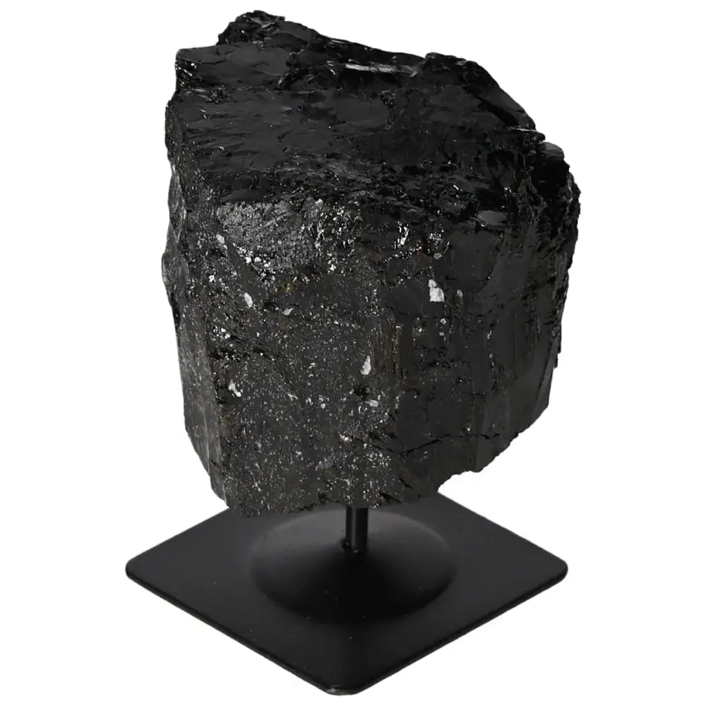 Rough black tourmaline crystal on metal stand from Sylvia Crystals, showcasing natural beauty and vibrant hues for display.