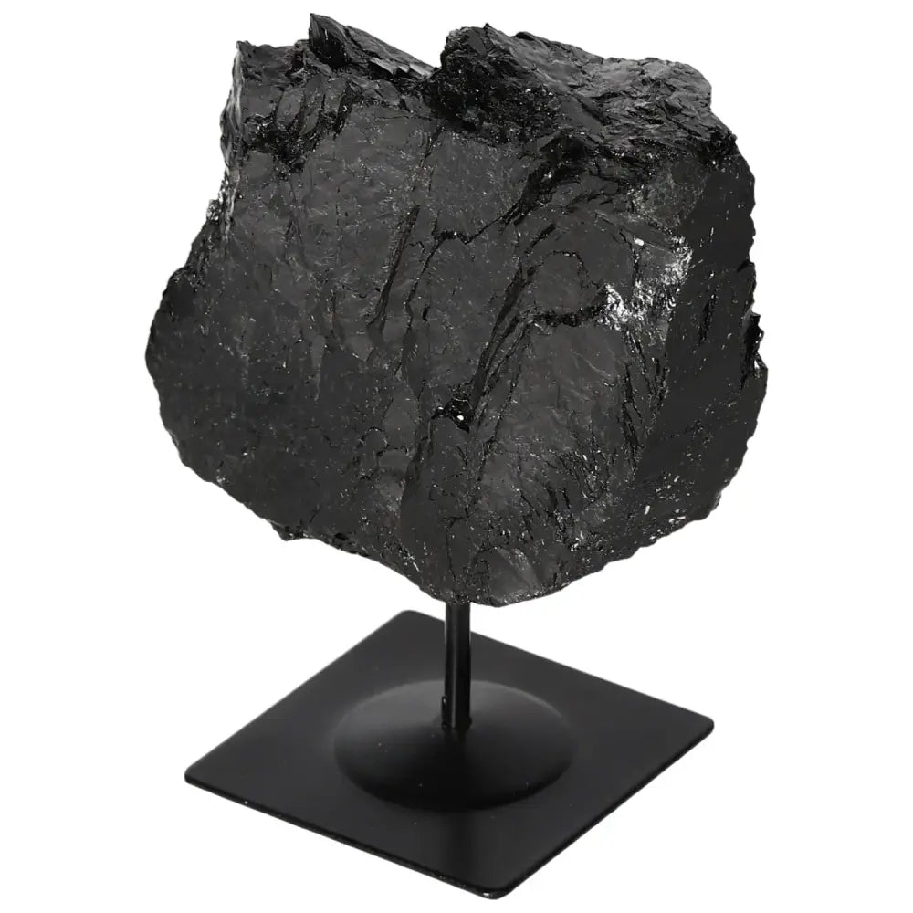 Rough Tourmaline on a sleek metal stand, showcasing luxury and spiritual harmony, ideal as a captivating centerpiece.