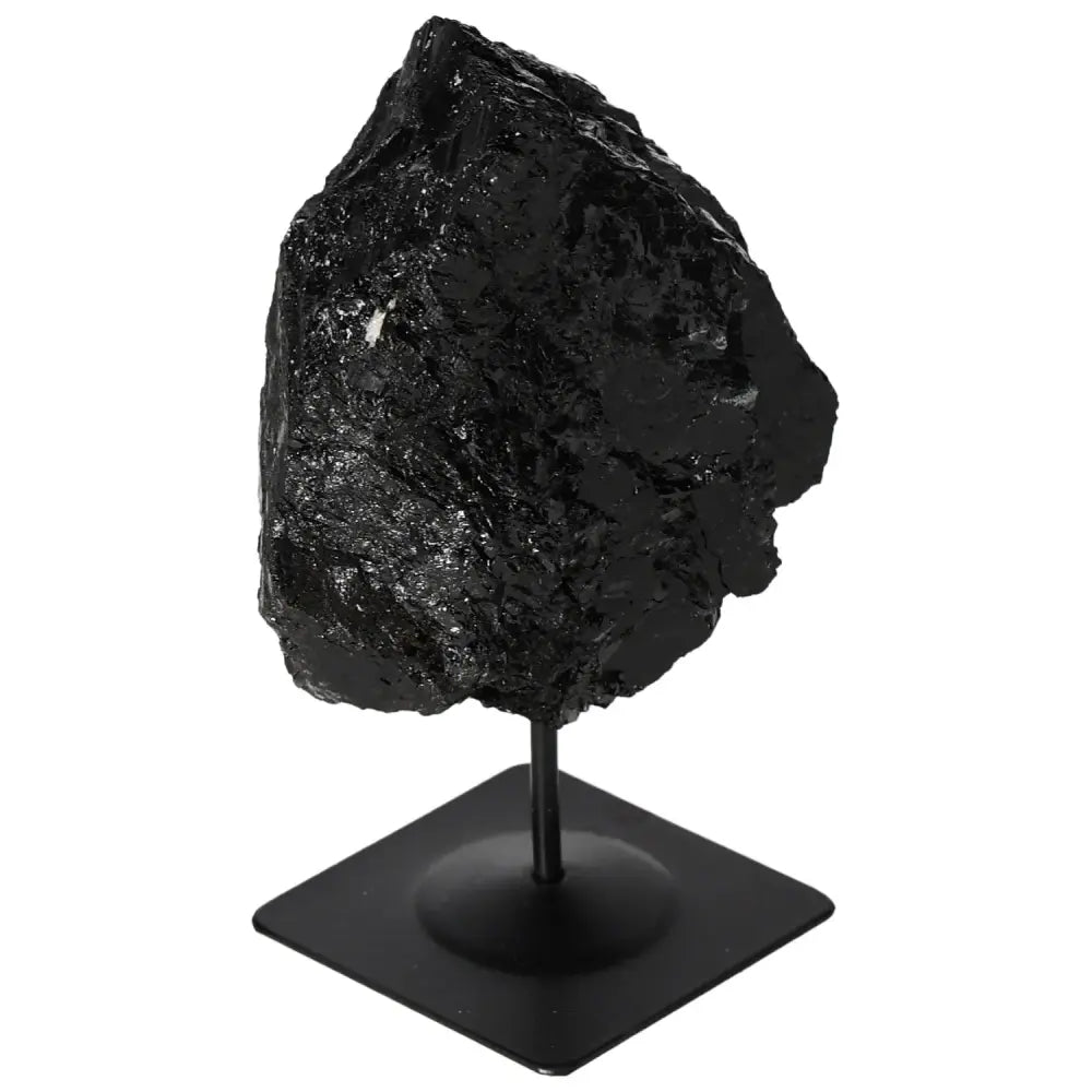 Rough Tourmaline gemstone on a sleek metal stand, showcasing its natural elegance and premium craftsmanship by Sylvia Crystals.