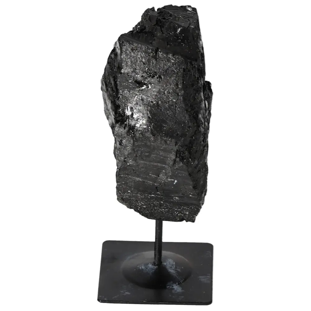 Rough Tourmaline gemstone on elegant metal stand, high-quality display crystal from Sylvia Crystals, adds natural beauty to any space.